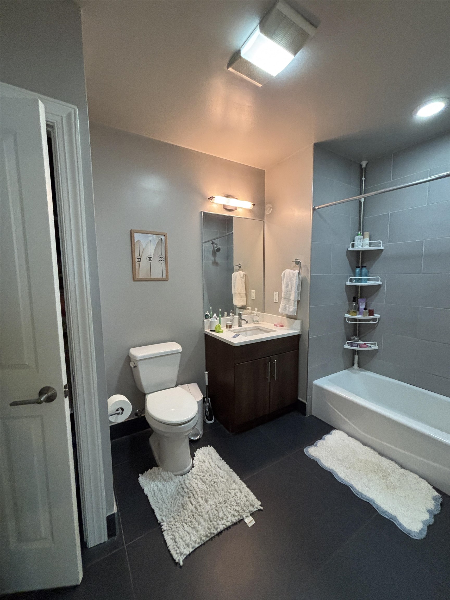 100 Marshall Street, Unit 316 Hoboken, NJ 07030 - Photo 5 of 9 a bathroom with a double vanity sink a toilet a mirror and shower