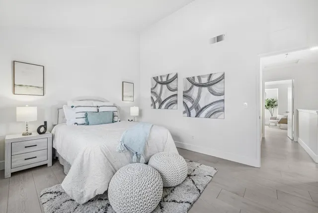 a bathroom with a sink a toilet and a large mirror