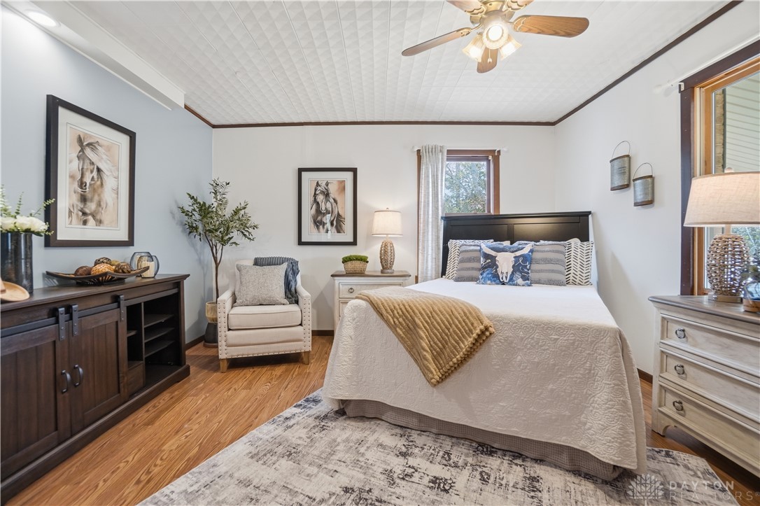 7553 Coffin Station Road Springfield, OH 45502 - Photo 53 of 95 This tranquil bedroom offers comfort and natural light, creating a peaceful personal retreat.