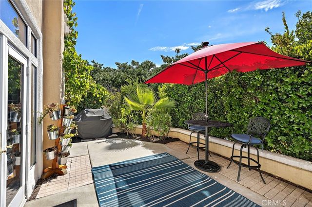 a view of a room with a window and wooden fence