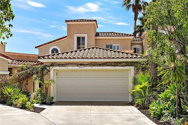 a front view of a house with a garage