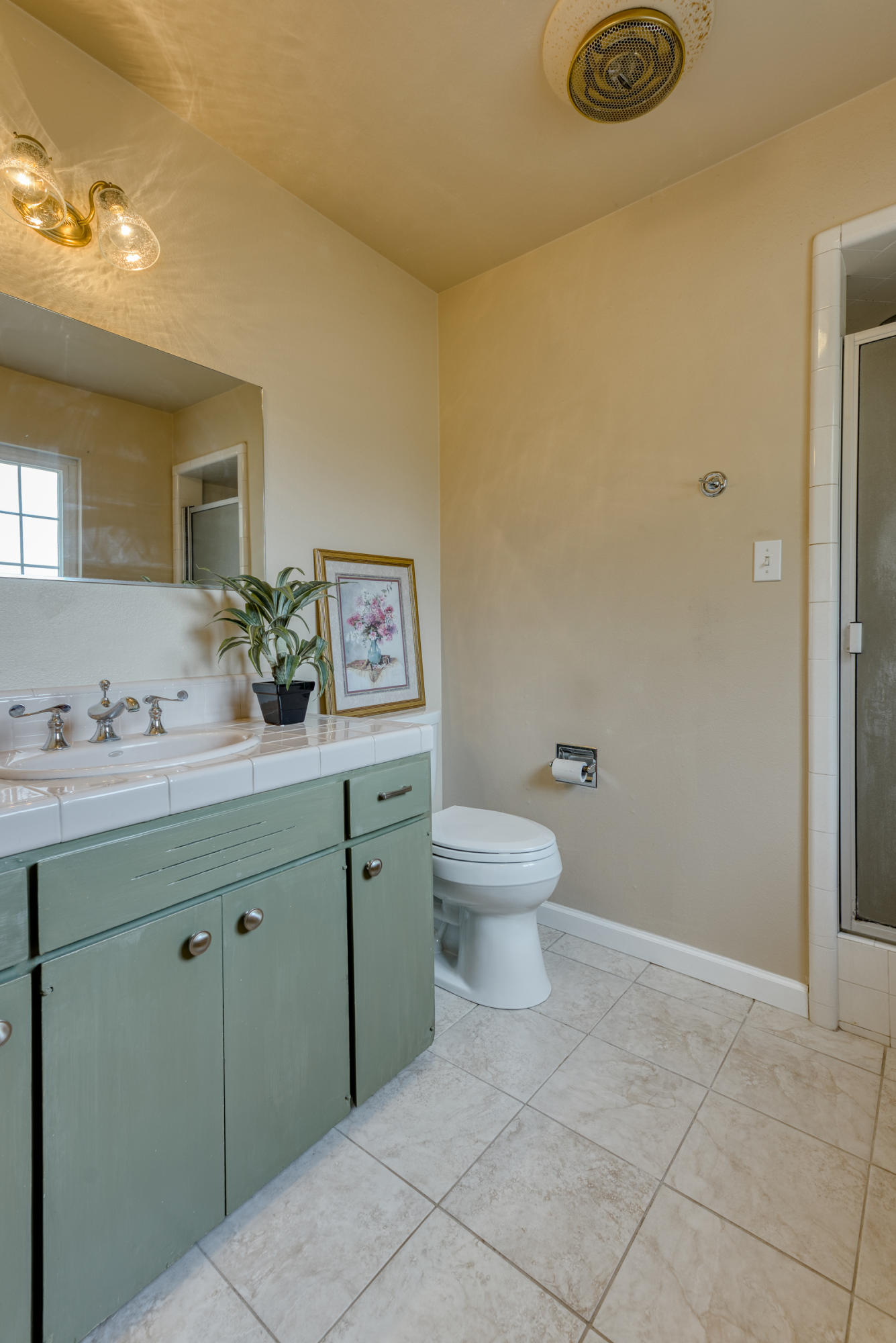 19970 Loafer Way Redding, CA 96002 - Photo 11 of 20 a bathroom with a toilet sink and mirror