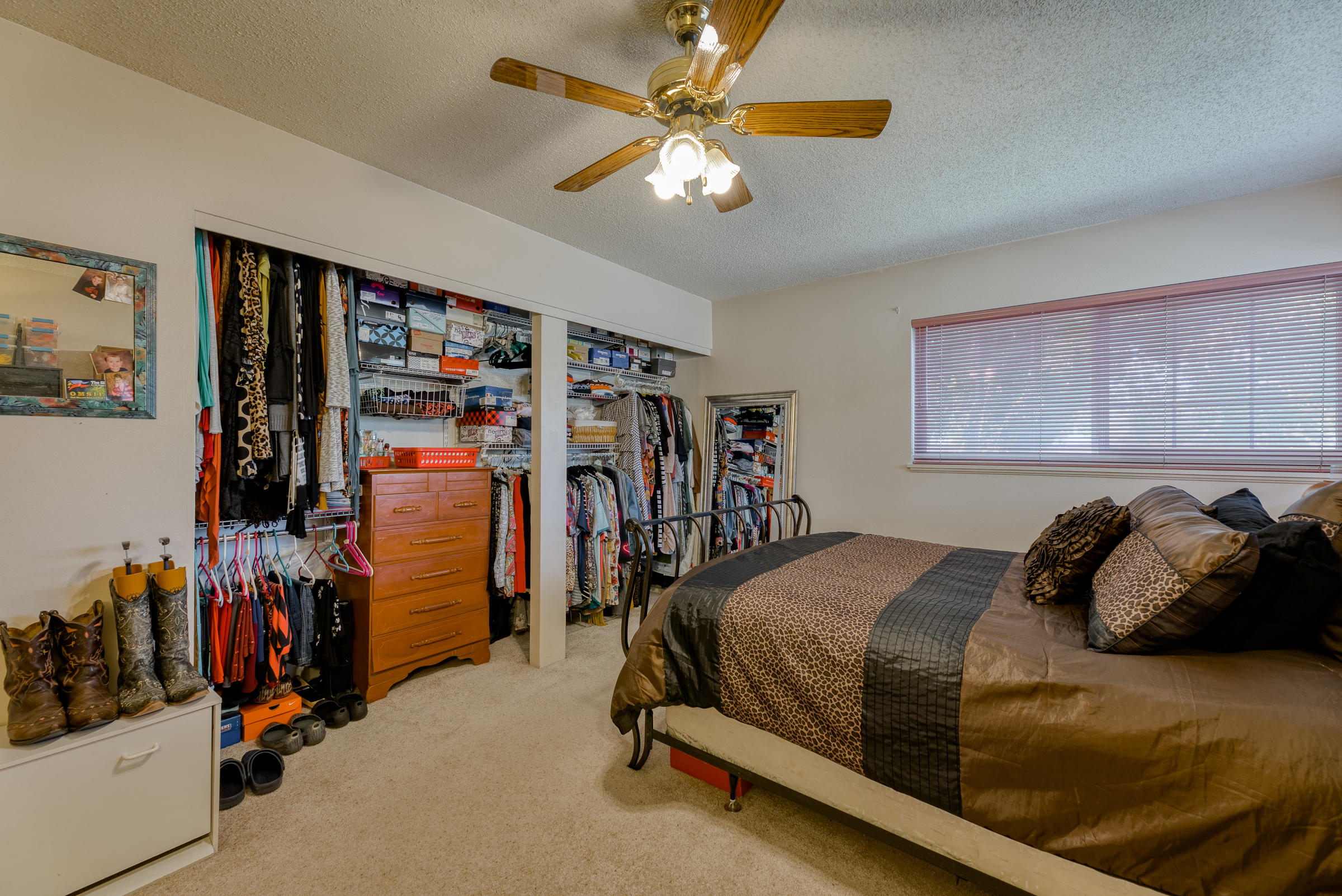 19970 Loafer Way Redding, CA 96002 - Photo 14 of 20 a bedroom with a bed and a walk in closet