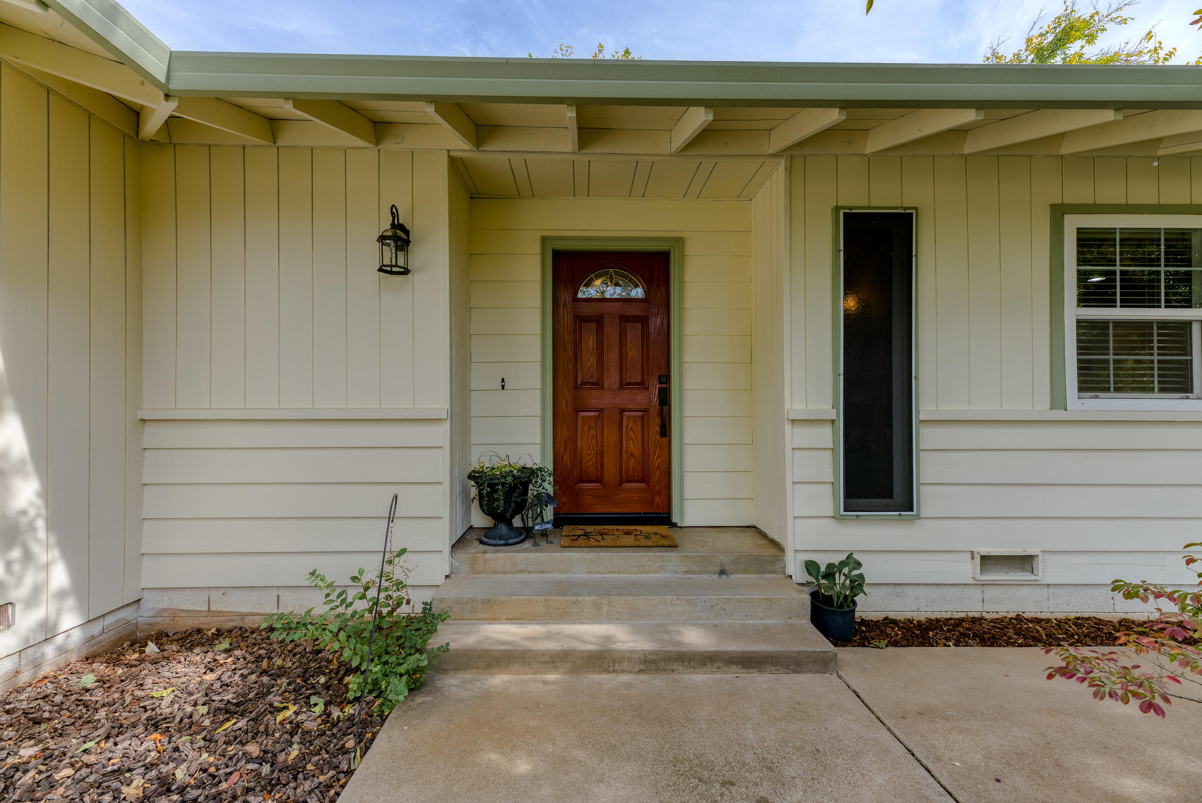 19970 Loafer Way Redding, CA 96002 - Photo 4 of 20 a front view of a house with a yard