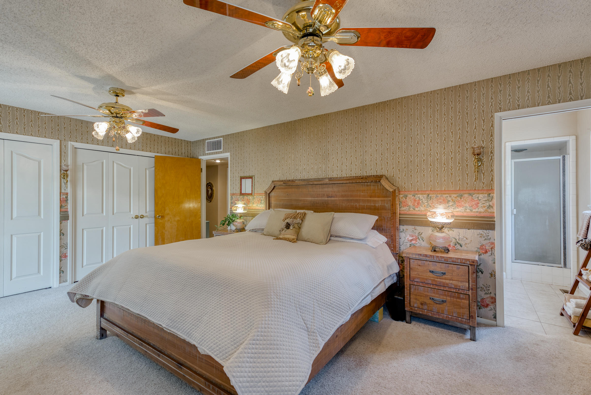 19970 Loafer Way Redding, CA 96002 - Photo 10 of 20 a bedroom with a bed and a chandelier