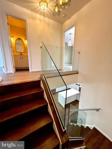 a view of a patio with table and chairs with wooden fence