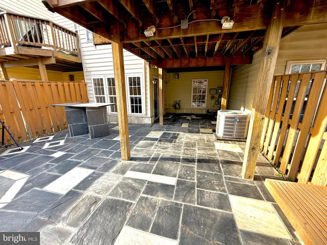 a view of a backyard with wooden fence