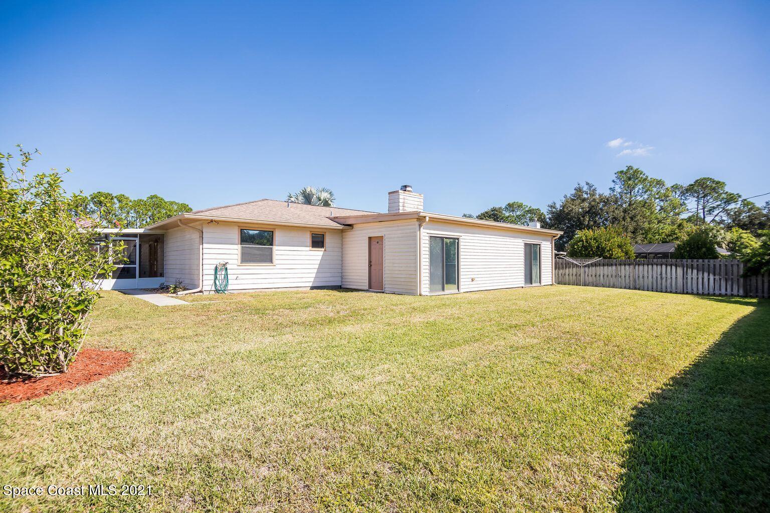 376 Trier Road Northwest Palm Bay, FL 32907 - Photo 15 of 16 a view of a house with a backyard