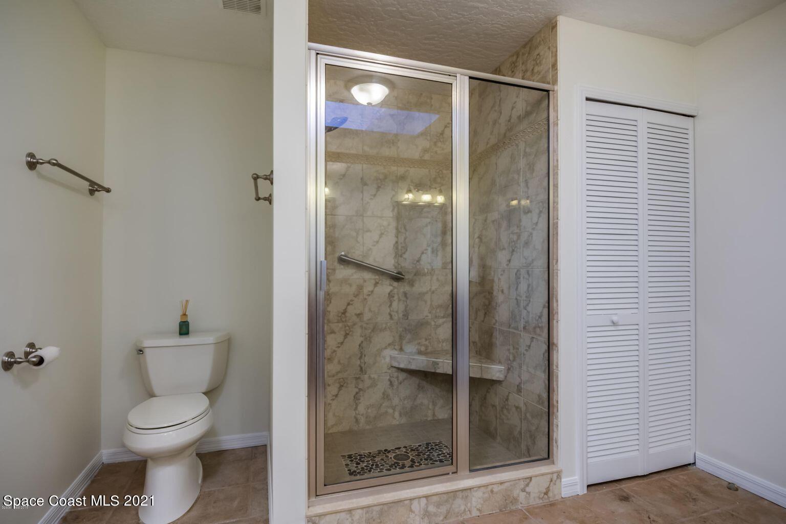 376 Trier Road Northwest Palm Bay, FL 32907 - Photo 7 of 16 a bathroom with a shower and toilet