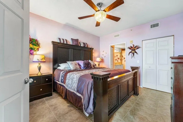 a kitchen with stainless steel appliances granite countertop a refrigerator a stove top oven a sink and dishwasher