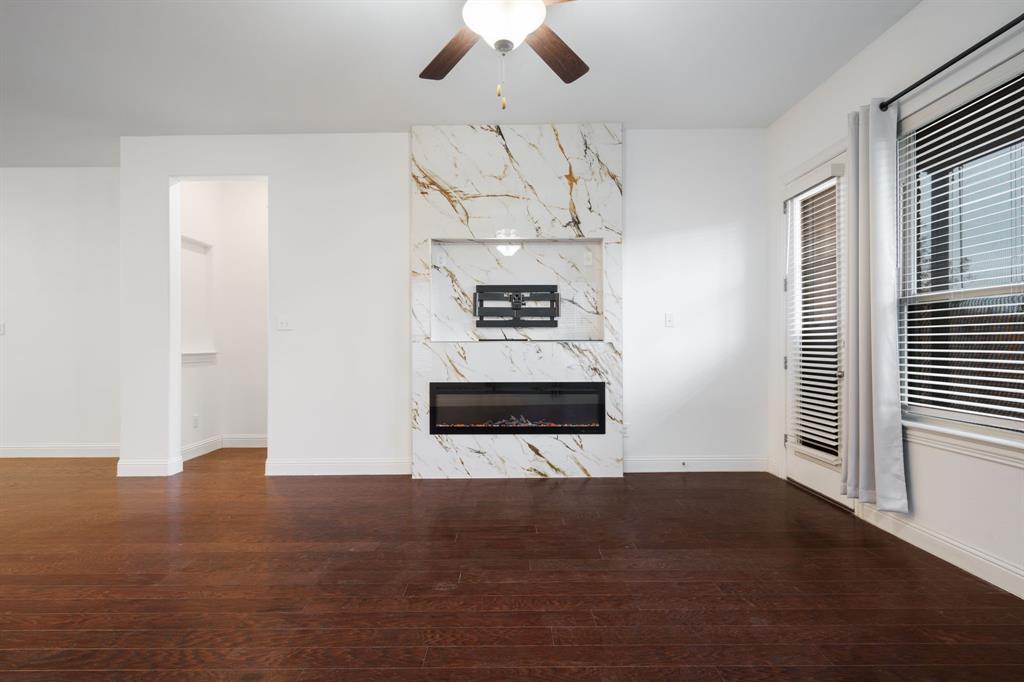 2144 Spencer Lane Carrollton, TX 75010 - Photo 19 of 31 with an electric fireplace