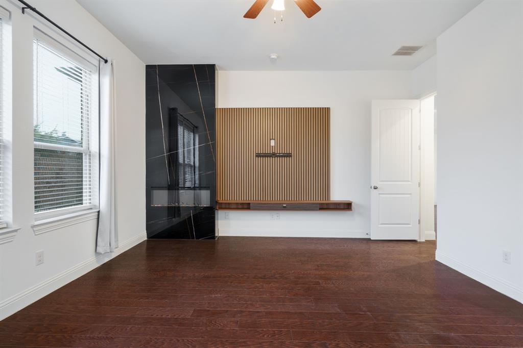 2144 Spencer Lane Carrollton, TX 75010 - Photo 22 of 31 with an electric fireplace