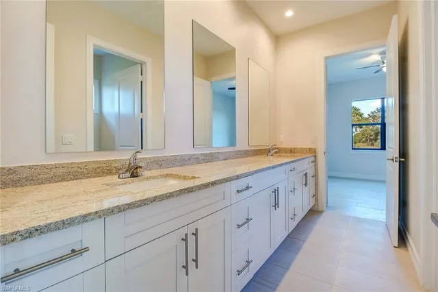 an empty room with a bathroom and a sink