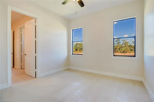 a bathroom with double sink and a mirror