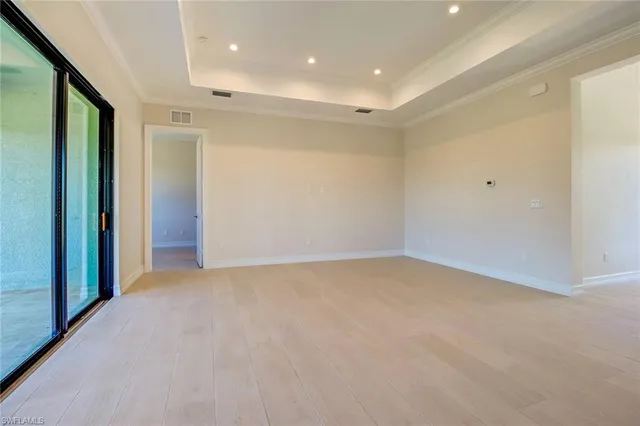 a view of an entryway with wooden floor