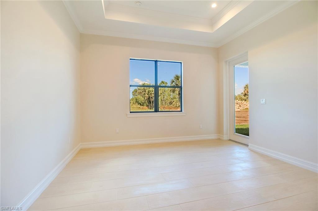 873 18th Street Northeast Naples, FL 34120 - Photo 8 of 18 an empty room with windows