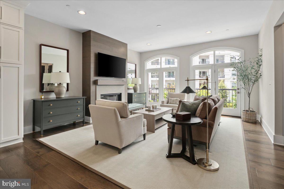 8129 River Road Bethesda, MD 20817 - Photo 22 of 84 a living room with furniture and a flat screen tv