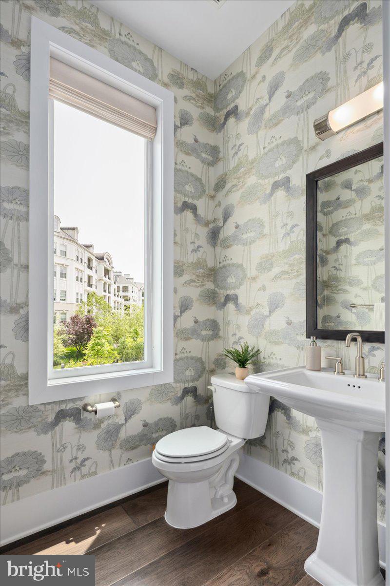 8129 River Road Bethesda, MD 20817 - Photo 28 of 84 a bathroom with a toilet a sink and a window