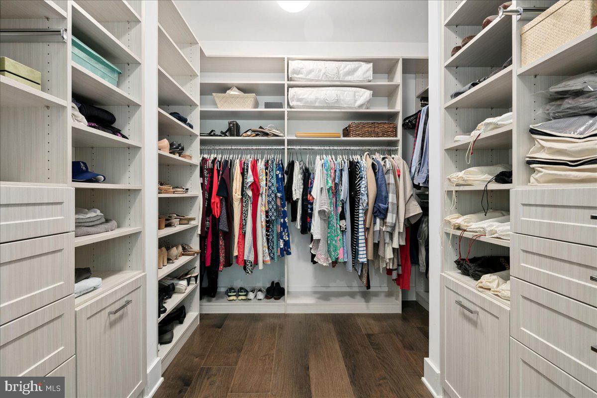 8129 River Road Bethesda, MD 20817 - Photo 41 of 84 a view of walk in closet with clothes and shoes