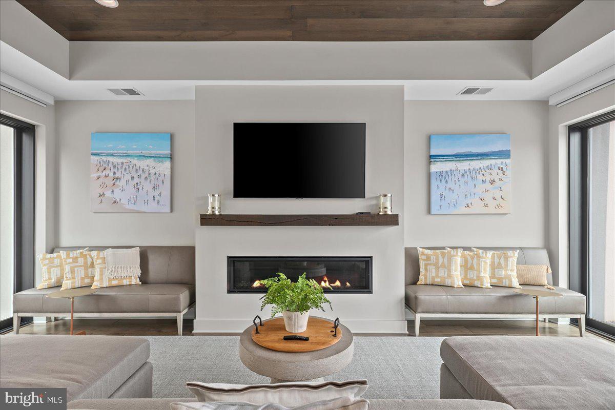 8129 River Road Bethesda, MD 20817 - Photo 61 of 84 a living room with furniture and a fireplace