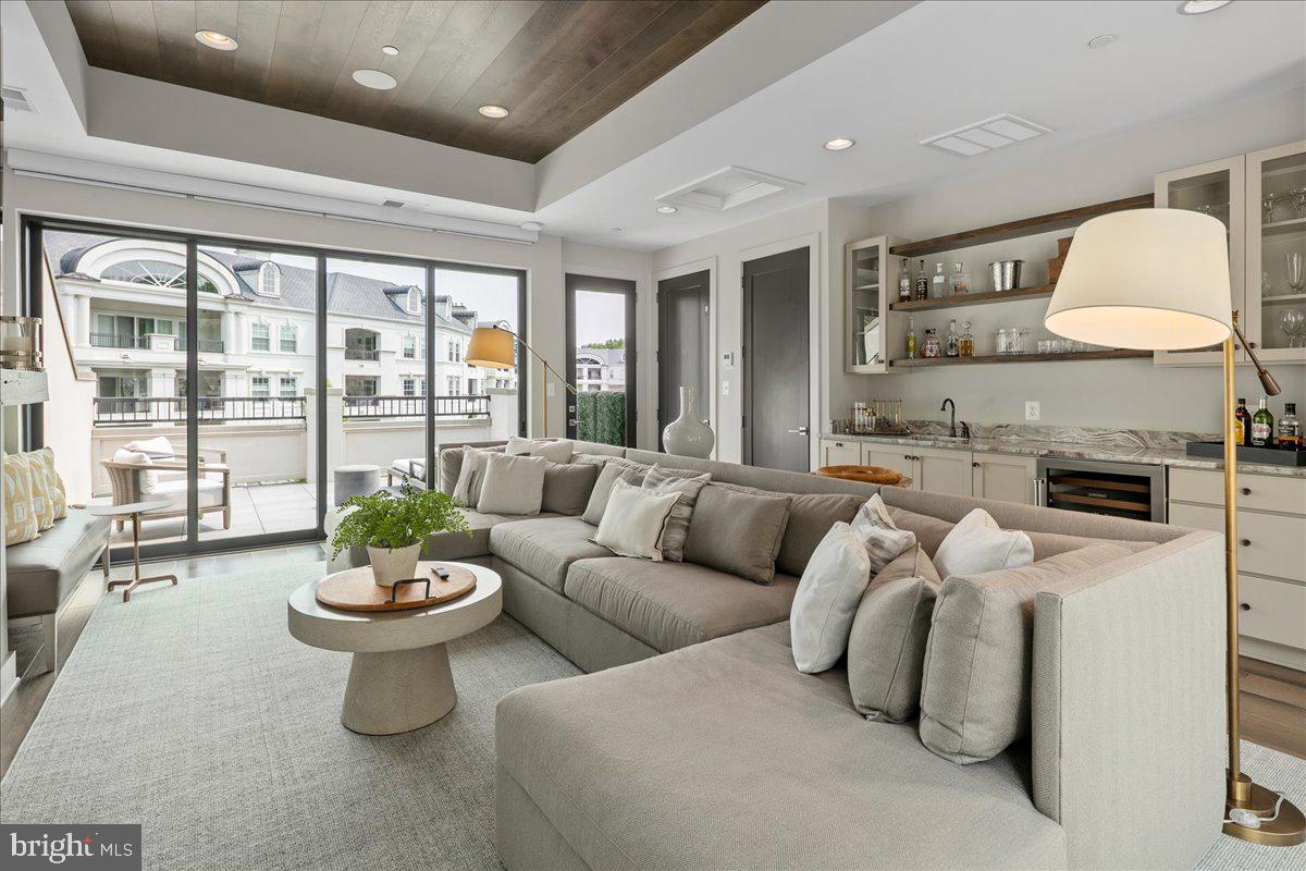 8129 River Road Bethesda, MD 20817 - Photo 62 of 84 a living room with furniture and a potted plant
