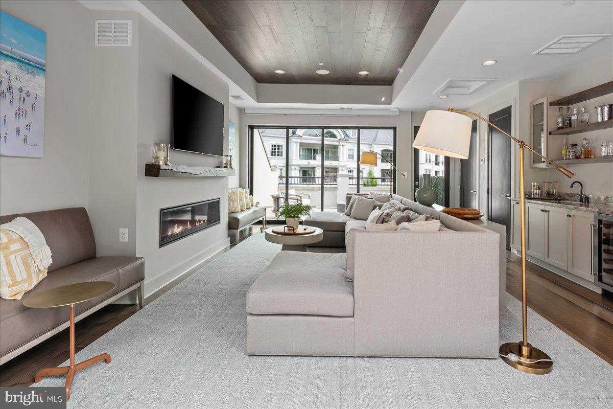 8129 River Road Bethesda, MD 20817 - Photo 63 of 84 a living room with furniture and a flat screen tv