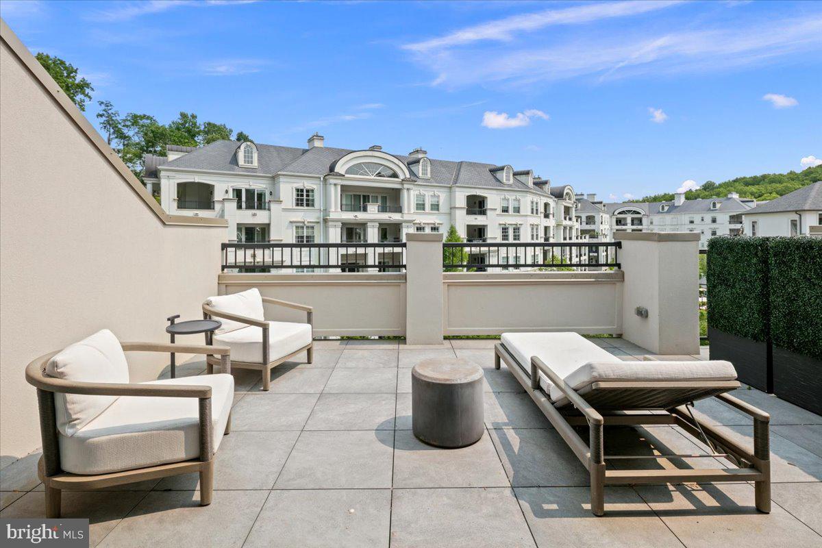 8129 River Road Bethesda, MD 20817 - Photo 65 of 84 a view of a chairs and table in a terrace