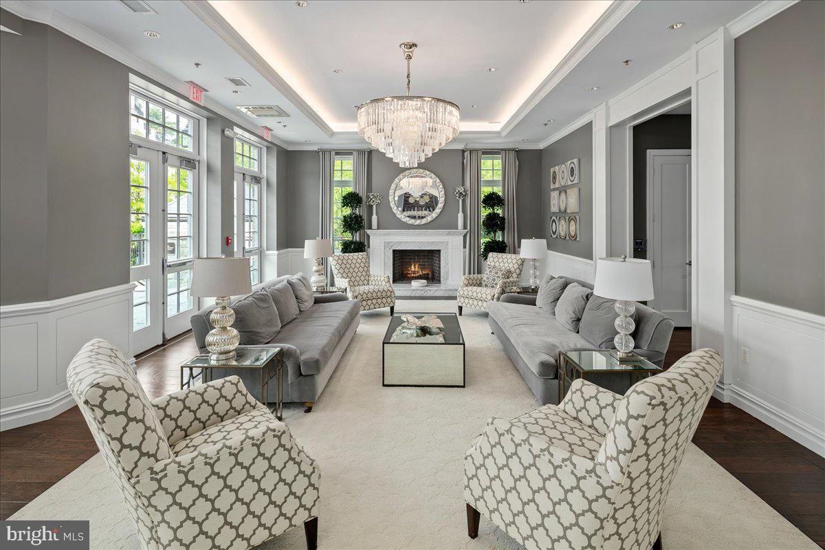 8129 River Road Bethesda, MD 20817 - Photo 74 of 84 a living room with furniture a chandelier and a window