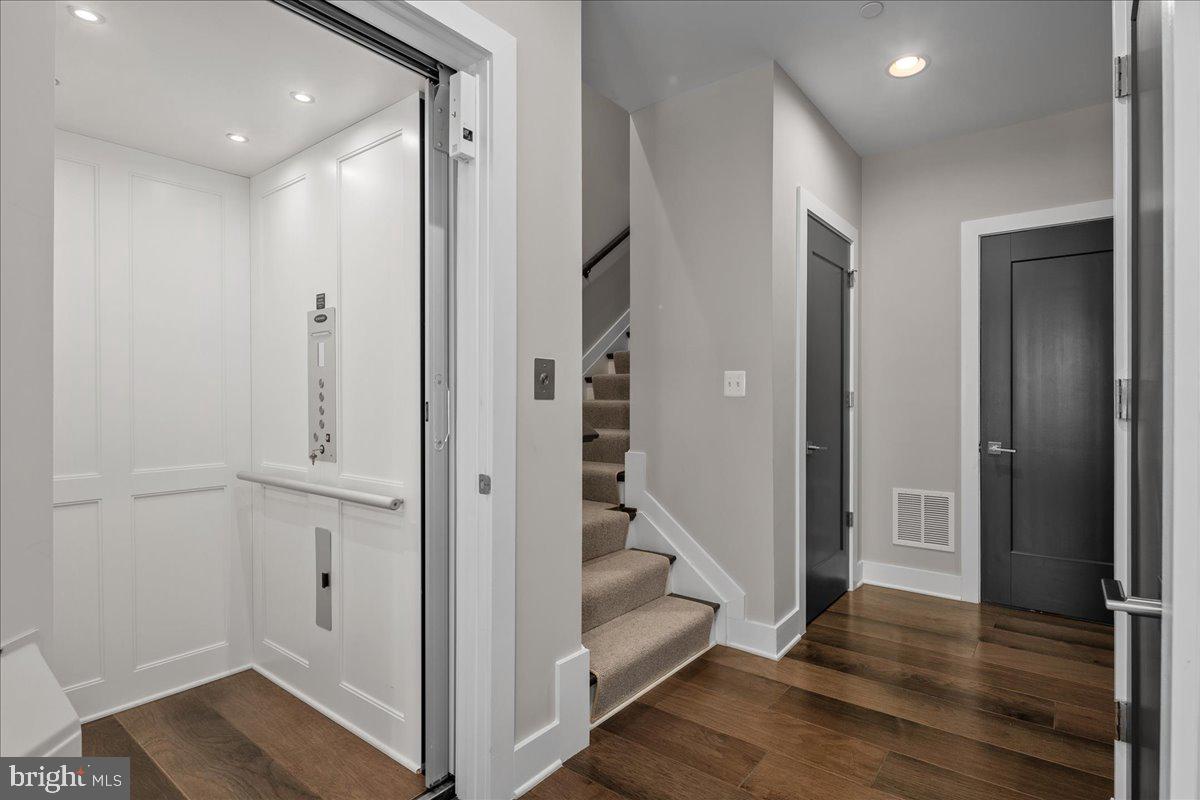 8129 River Road Bethesda, MD 20817 - Photo 9 of 84 a view of a hallway with wooden floor and entryway