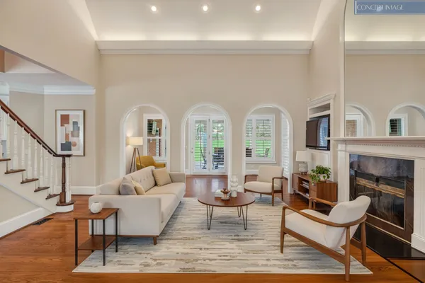 a living room with fireplace furniture and a fireplace