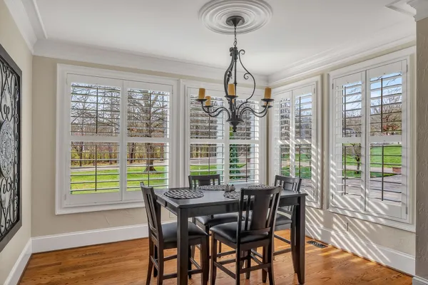 a kitchen with a cabinets and a wooden floor