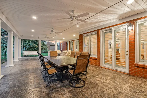 a front view of a house with a yard table and chairs