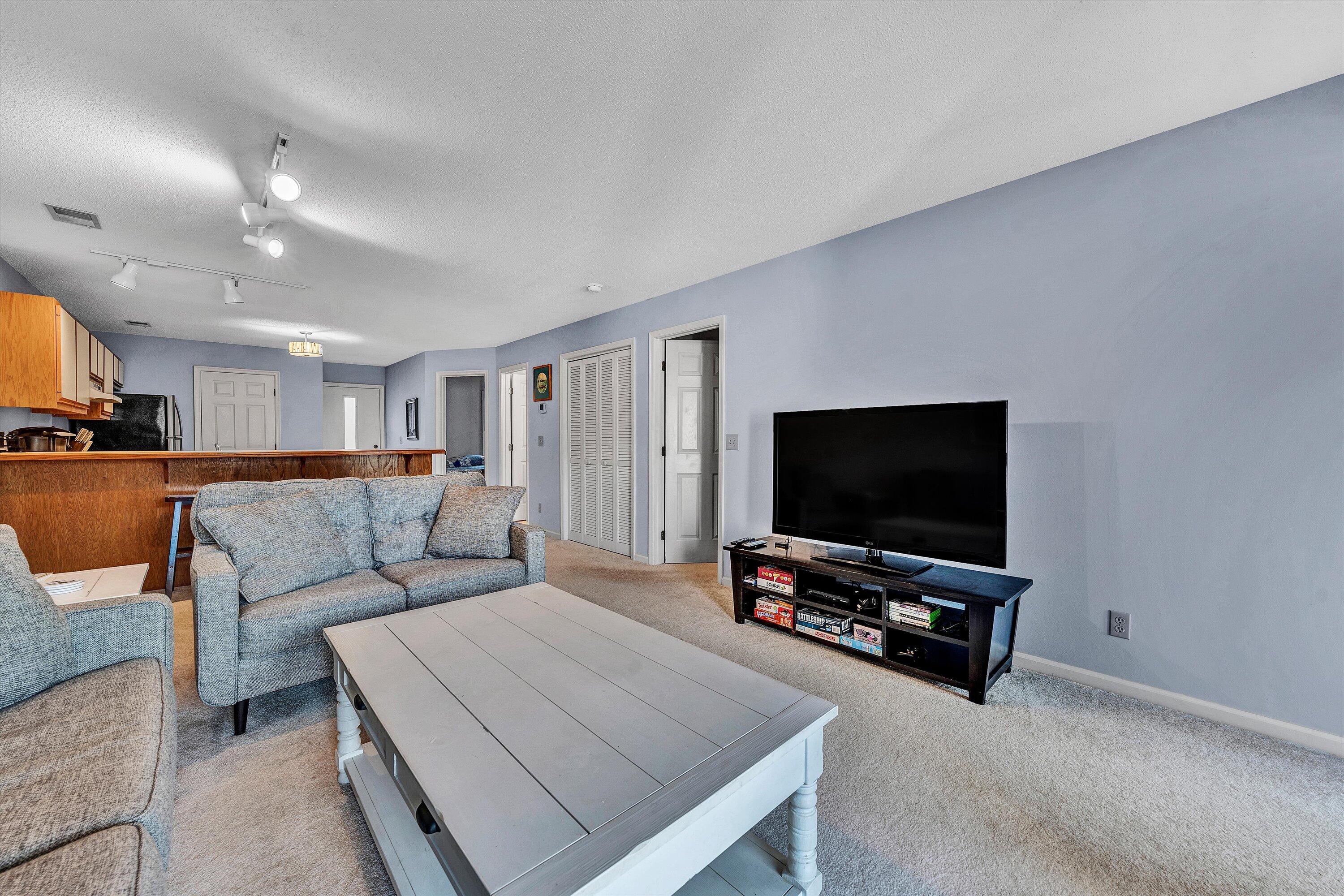 600 Monte Vista Road, Unit 802 Union Hall, VA 24176 - Photo 13 of 32 a living room with furniture and a flat screen tv