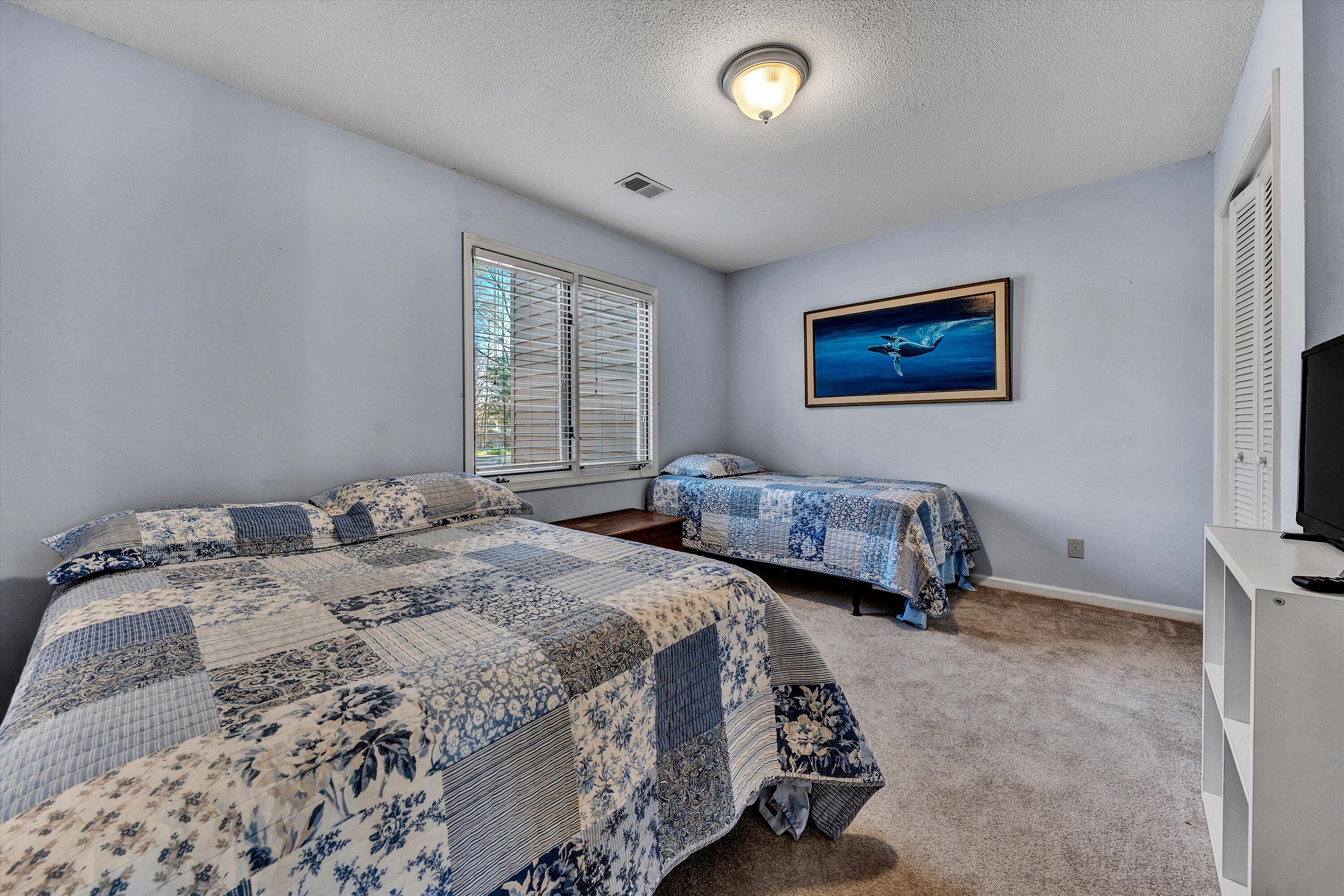 600 Monte Vista Road, Unit 802 Union Hall, VA 24176 - Photo 9 of 32 a bedroom with two beds and a painting on the wall