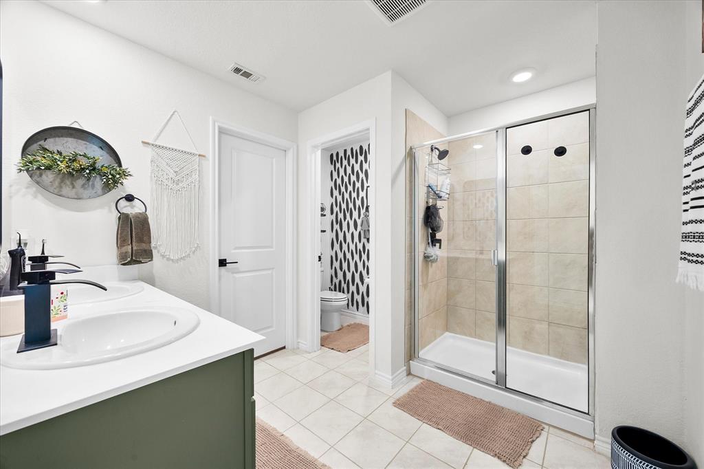 1003 Stage Coach Lane Princeton, TX 75407 - Photo 15 of 26 a bathroom with a sink and a mirror