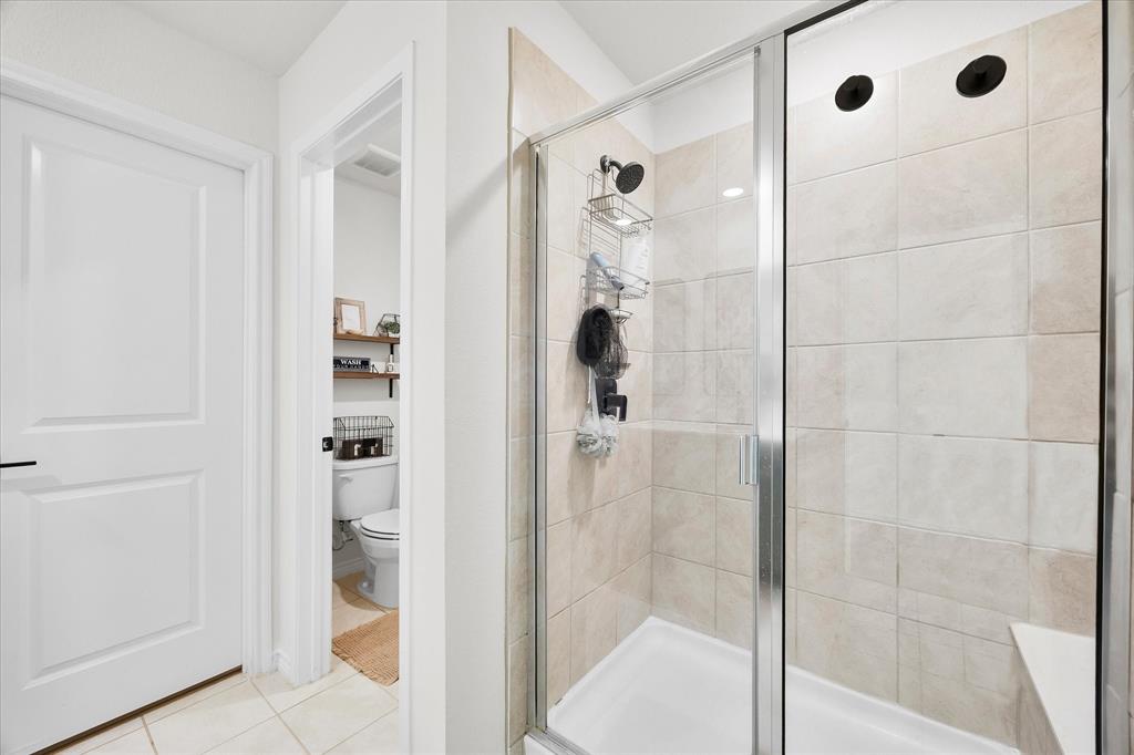 1003 Stage Coach Lane Princeton, TX 75407 - Photo 17 of 26 a bathroom with a shower