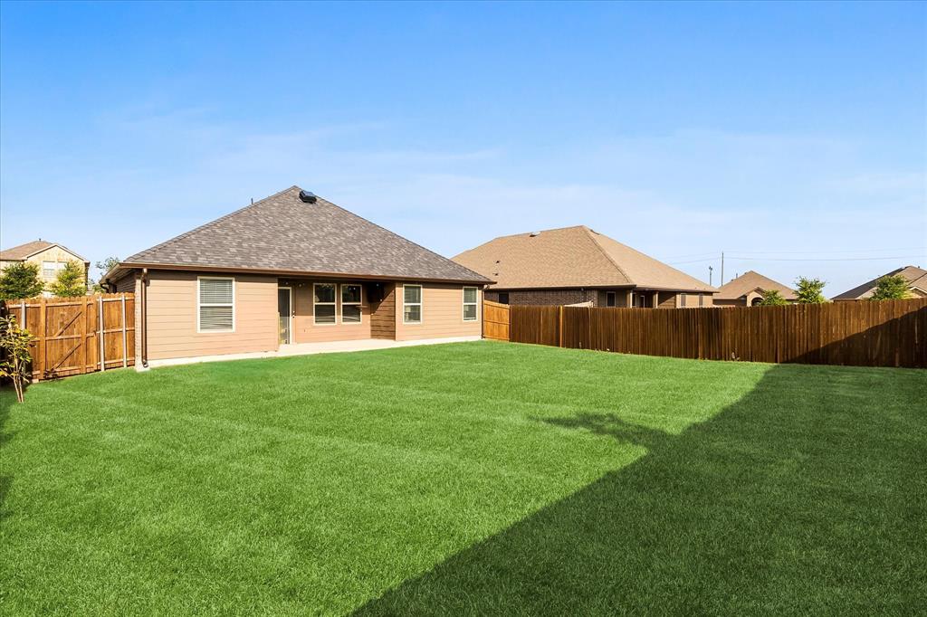 1003 Stage Coach Lane Princeton, TX 75407 - Photo 22 of 26 a view of an house with backyard space and garden