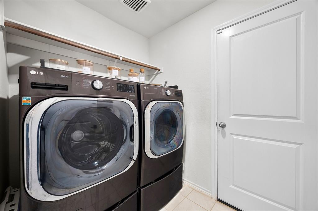 1003 Stage Coach Lane Princeton, TX 75407 - Photo 26 of 26 a utility room with dryer and washer