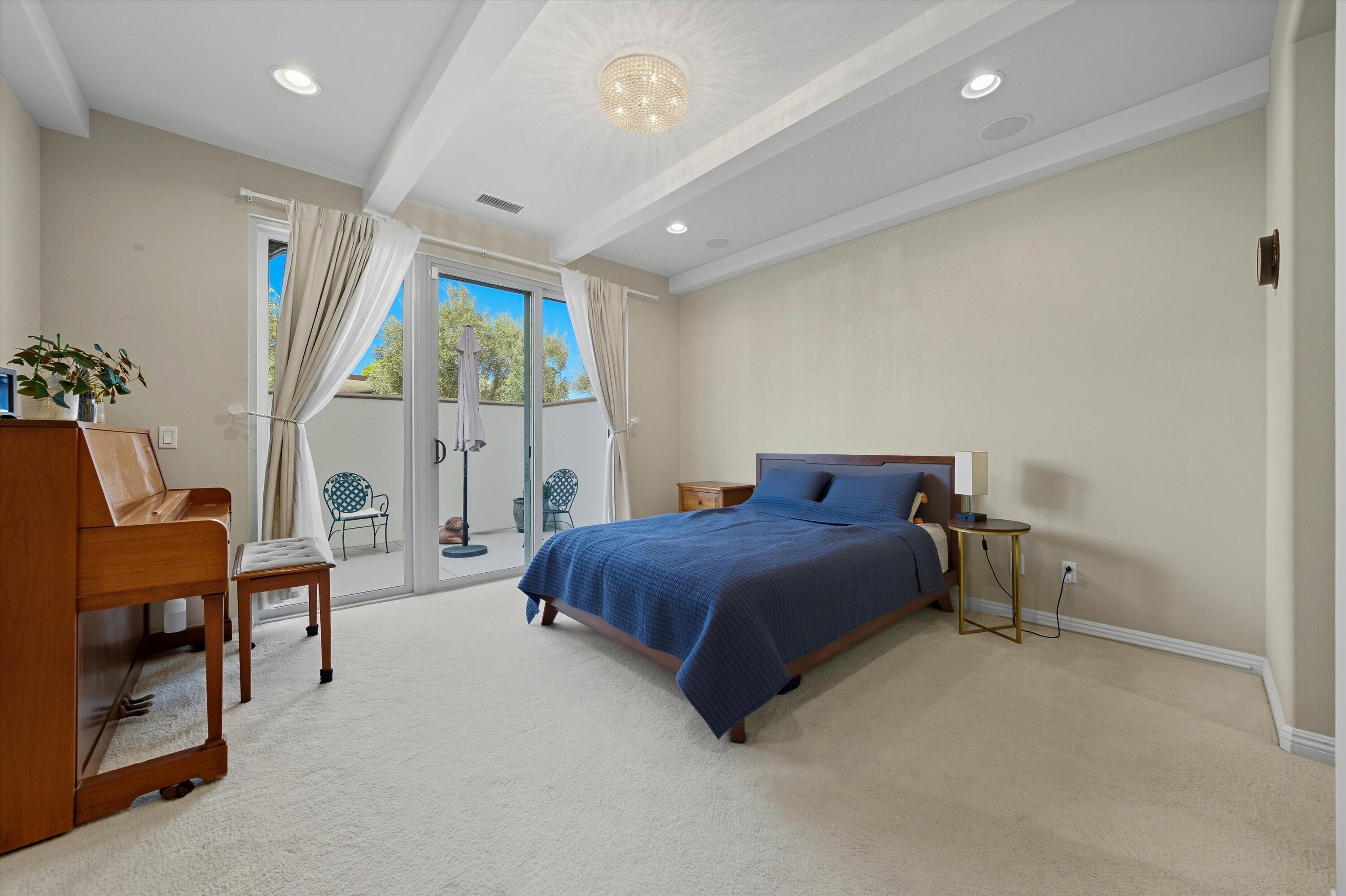 80256 Redstone Way, Unit V93 La Quinta, CA 92253 - Photo 15 of 37 a spacious bedroom with a bed and a window