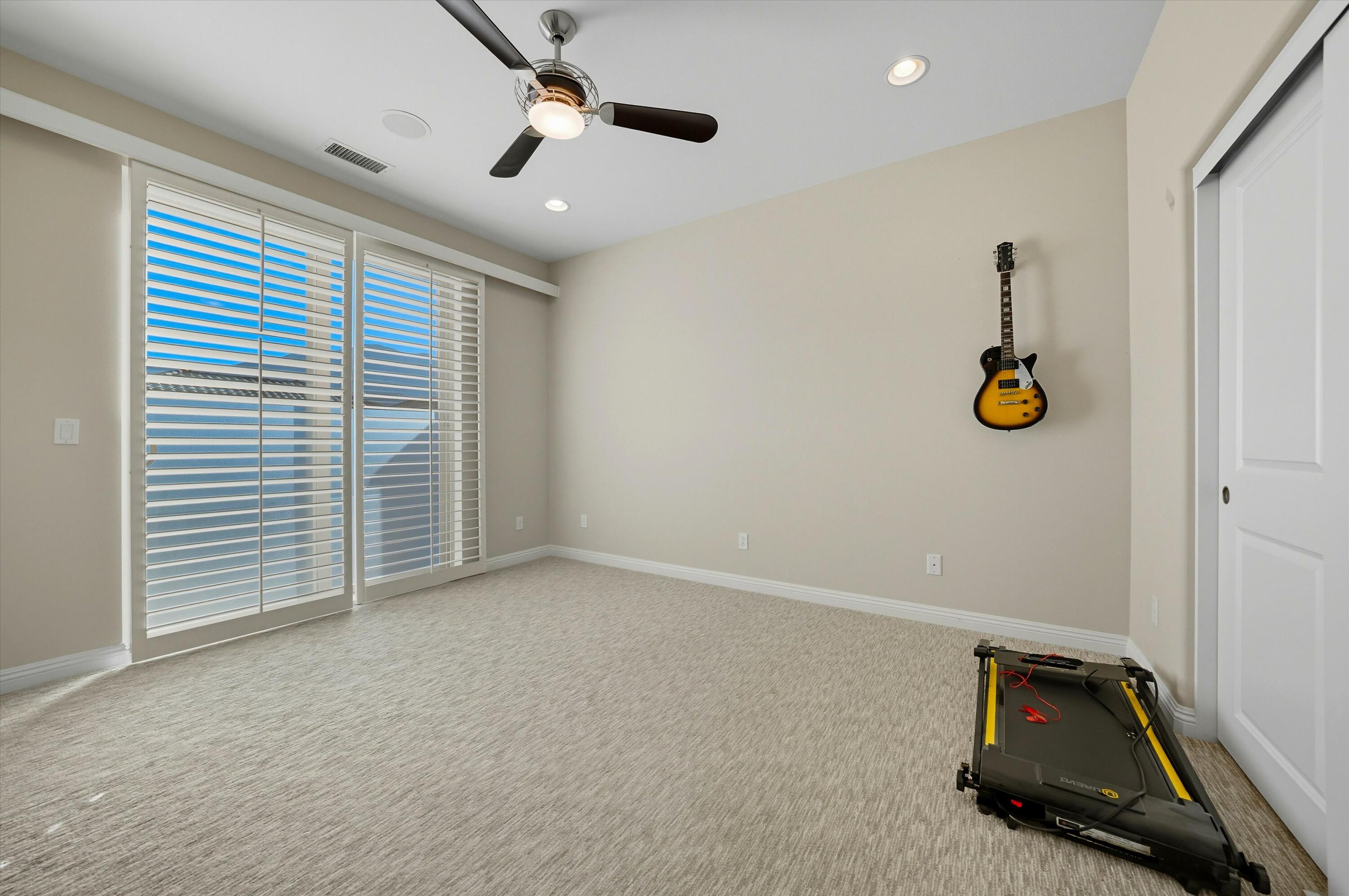 80256 Redstone Way, Unit V93 La Quinta, CA 92253 - Photo 22 of 37 a view of room with gym equipment