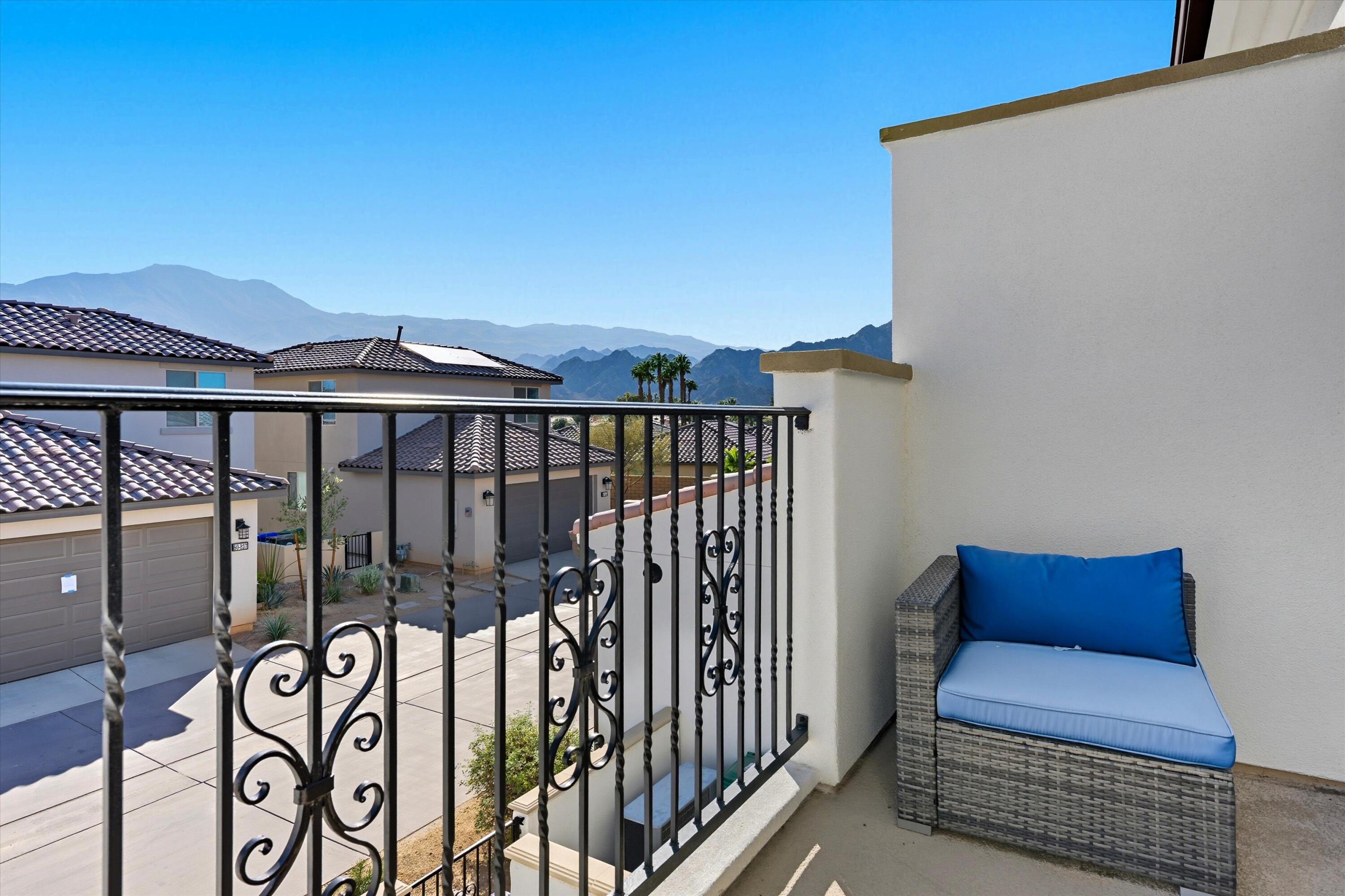 80256 Redstone Way, Unit V93 La Quinta, CA 92253 - Photo 25 of 37 a view of a chairs and table in the balcony