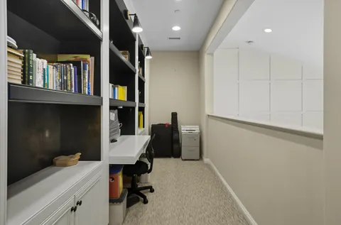 a view of a workspace with furniture