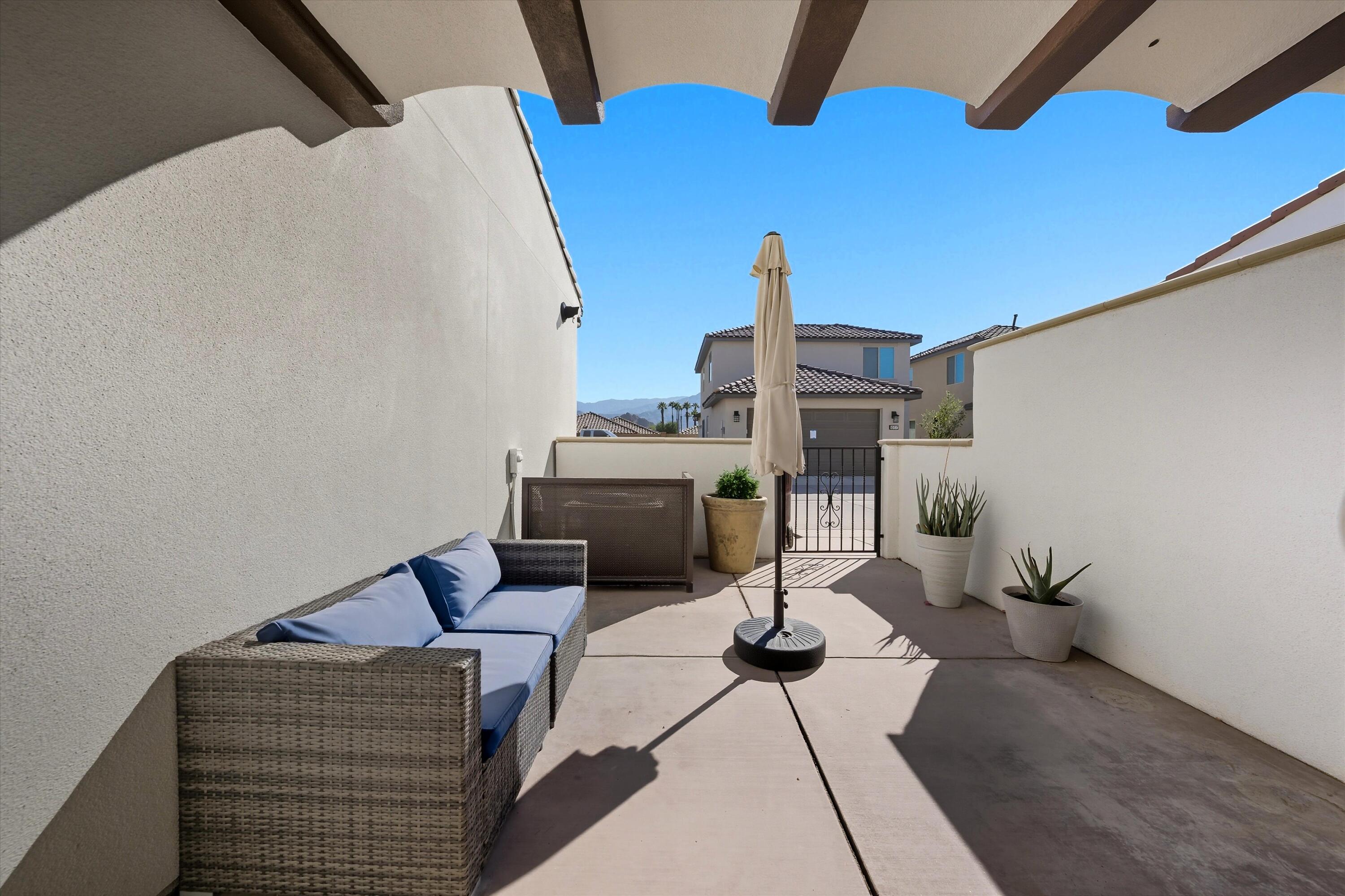 80256 Redstone Way, Unit V93 La Quinta, CA 92253 - Photo 29 of 37 a view of a terrace with furniture