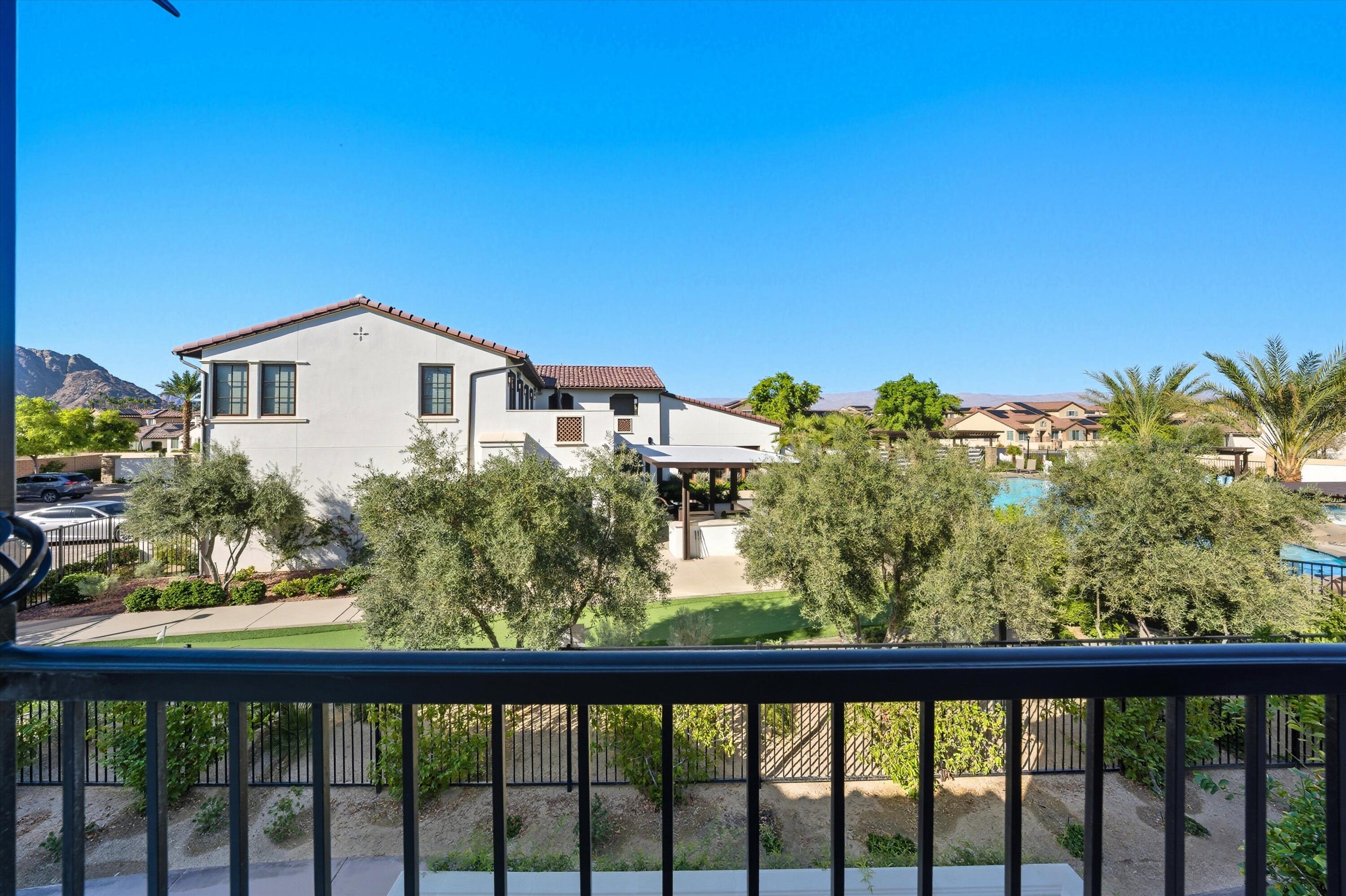 80256 Redstone Way, Unit V93 La Quinta, CA 92253 - Photo 30 of 37 a view of a small yard in front of a house