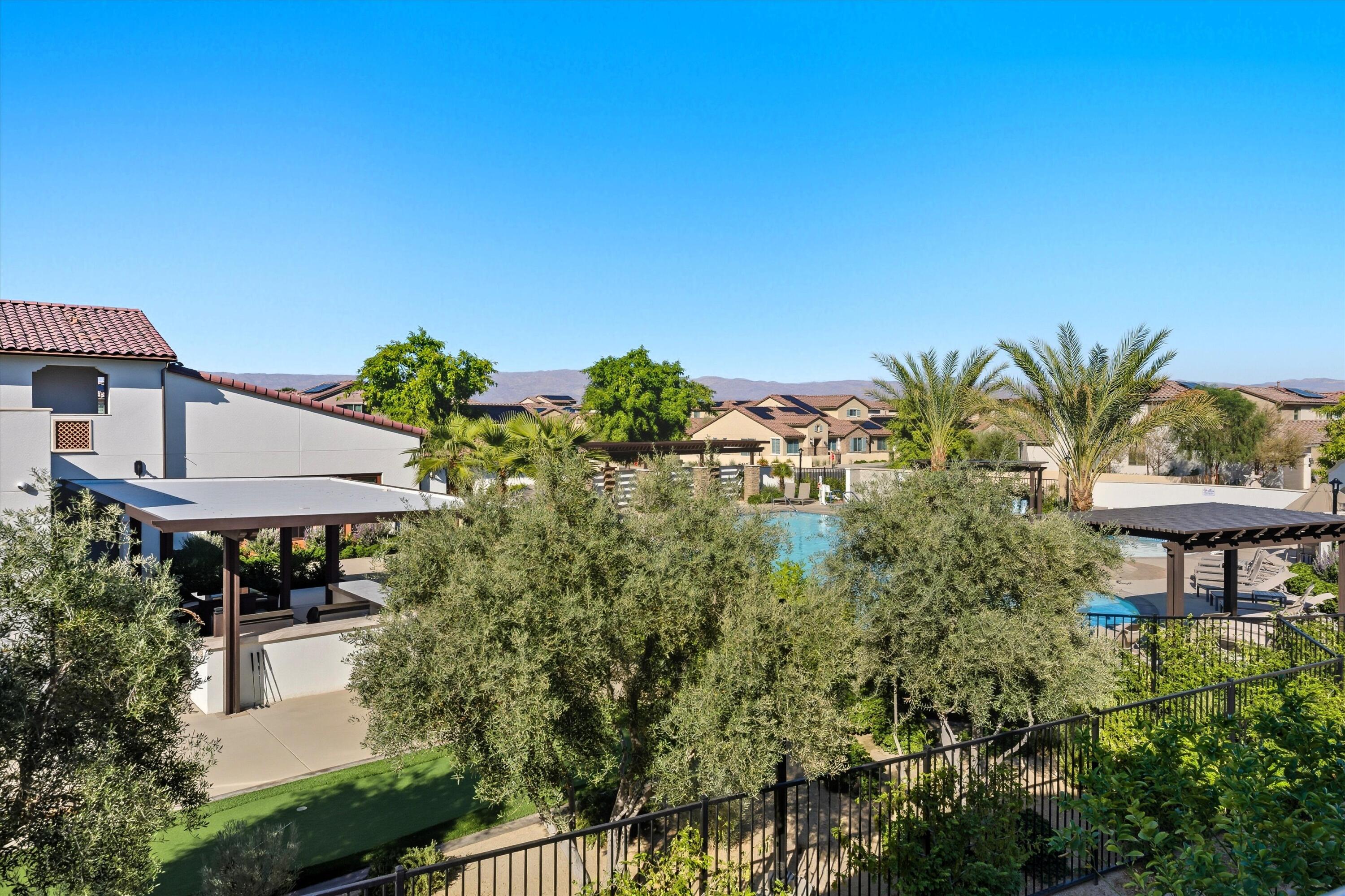 80256 Redstone Way, Unit V93 La Quinta, CA 92253 - Photo 32 of 37 a view of a garden