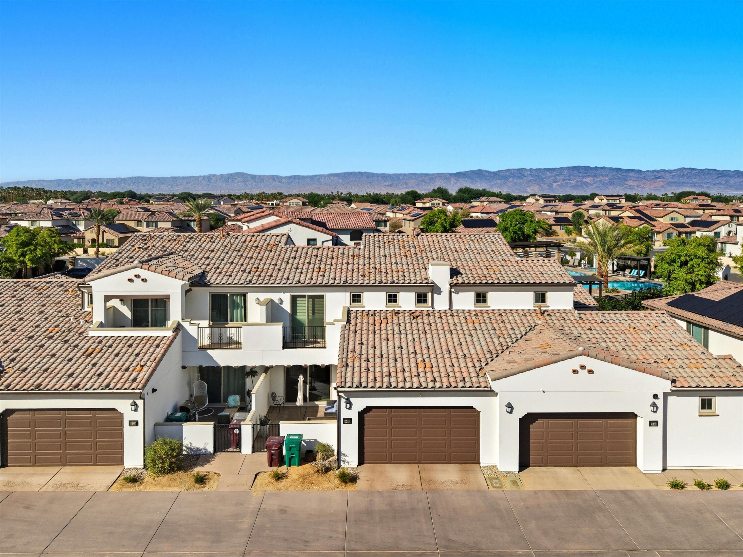 80256 Redstone Way, Unit V93 La Quinta, CA 92253 - Photo 35 of 37 an aerial view of a house with a yard