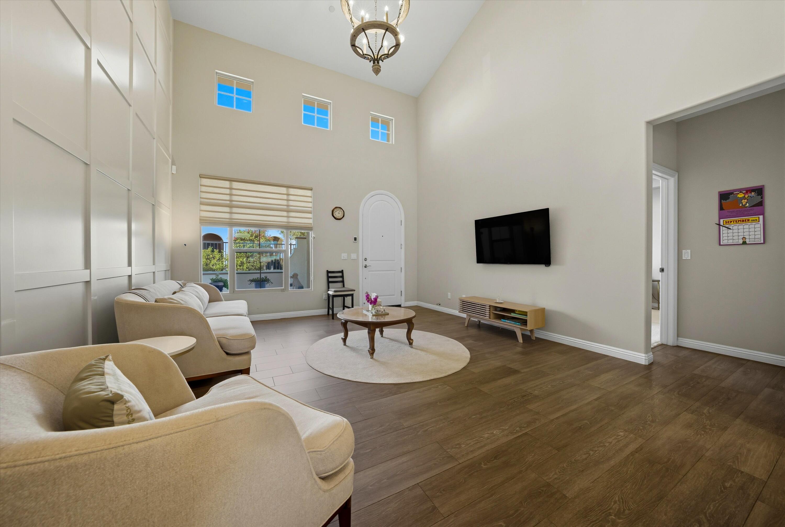 80256 Redstone Way, Unit V93 La Quinta, CA 92253 - Photo 7 of 37 a living room with furniture and a flat screen tv