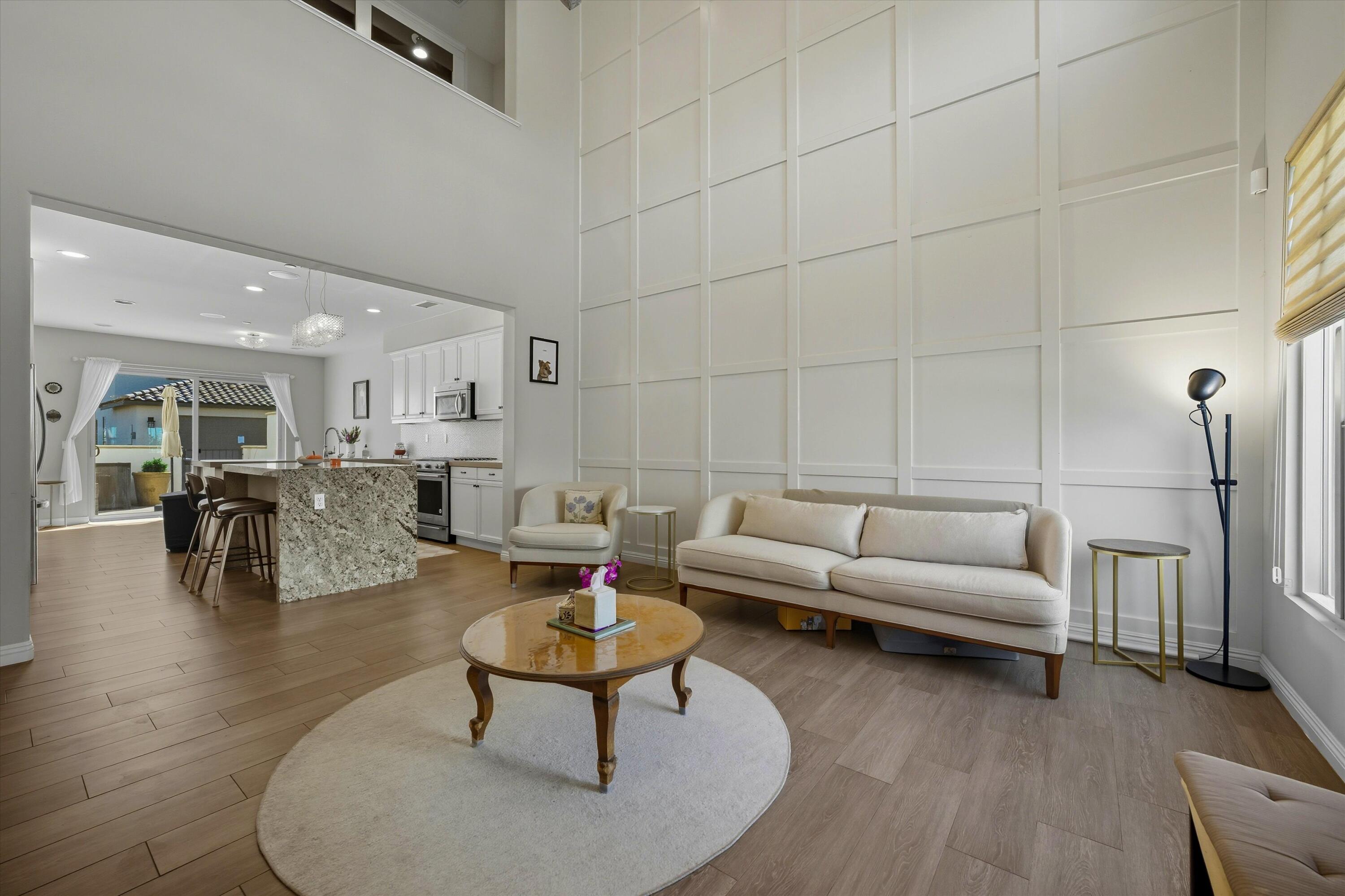 80256 Redstone Way, Unit V93 La Quinta, CA 92253 - Photo 8 of 37 a living room with furniture and a table