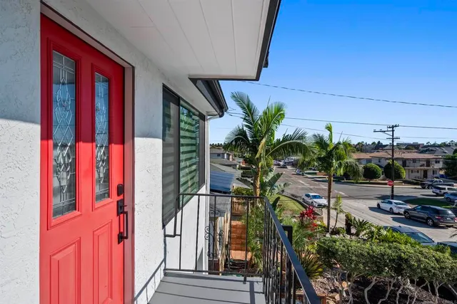 a living room with furniture flat screen tv and couches