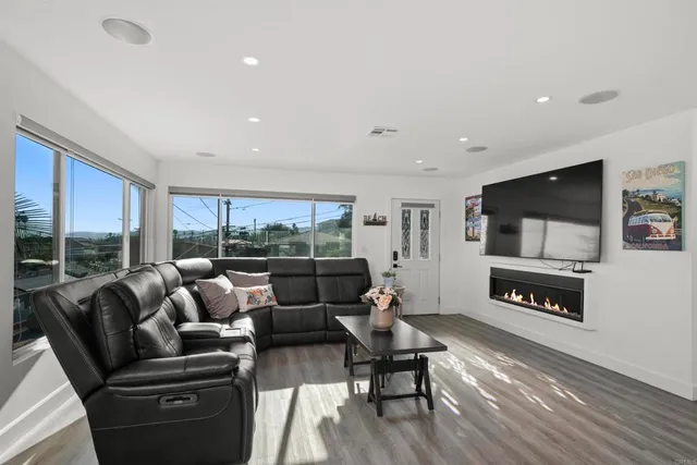 a kitchen with stainless steel appliances granite countertop a sink a stove a refrigerator and cabinets